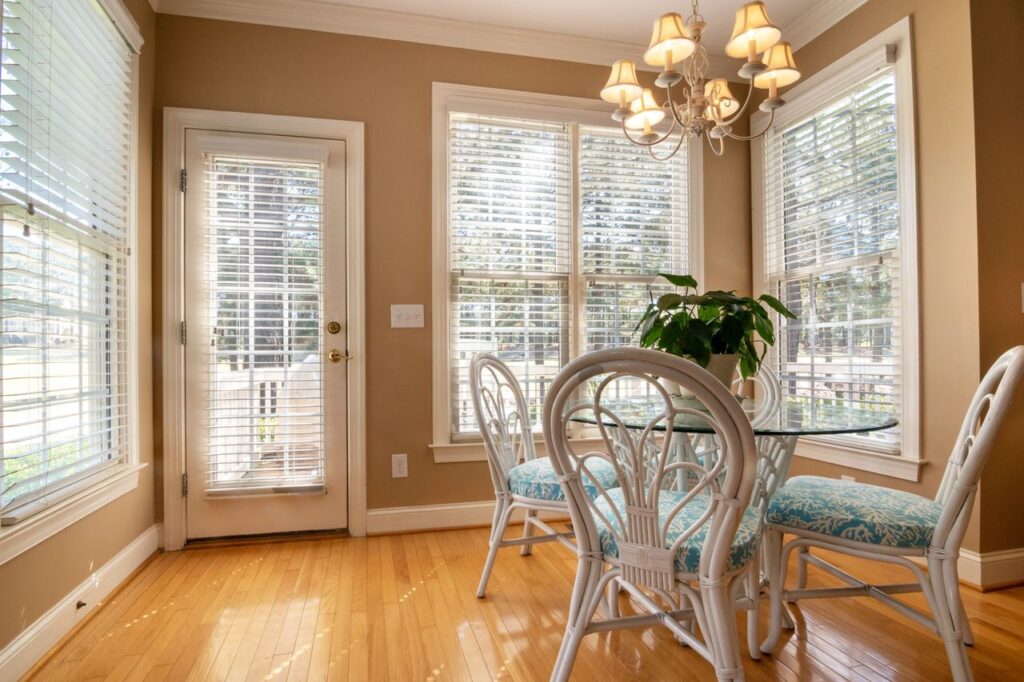 Crafting Captivating Headlines: Your awesome post title goes here Stylish dining room with large windows and modern furnishings, bathed in natural light.